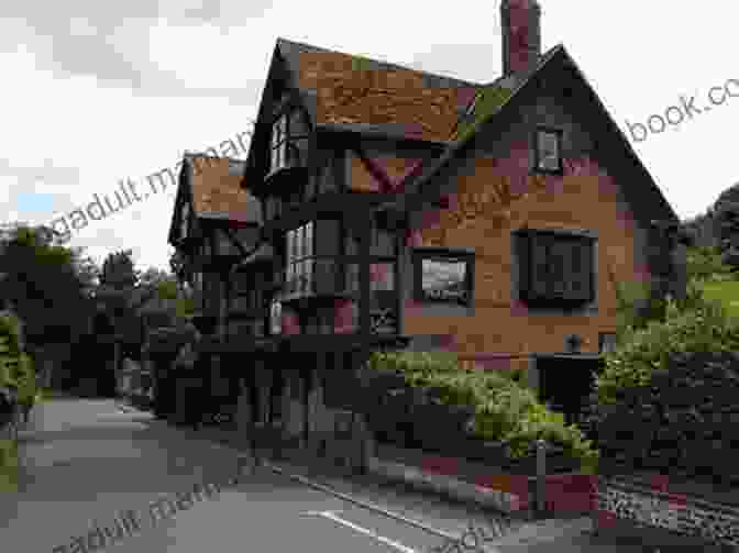 Exterior View Of The Hob And Hound Pub, A Charming Historic Building With Wooden Beams And A Thatched Roof. The Hob And Hound Pub (Sam Quinn 4)